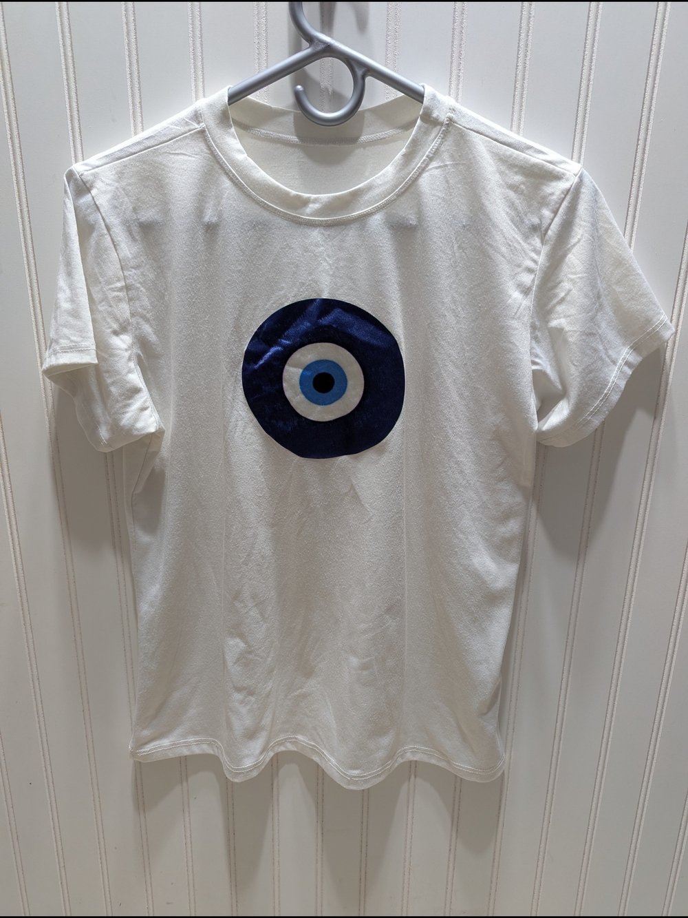 White Women's T‑Shirt with Blue Greek Eye Graphic